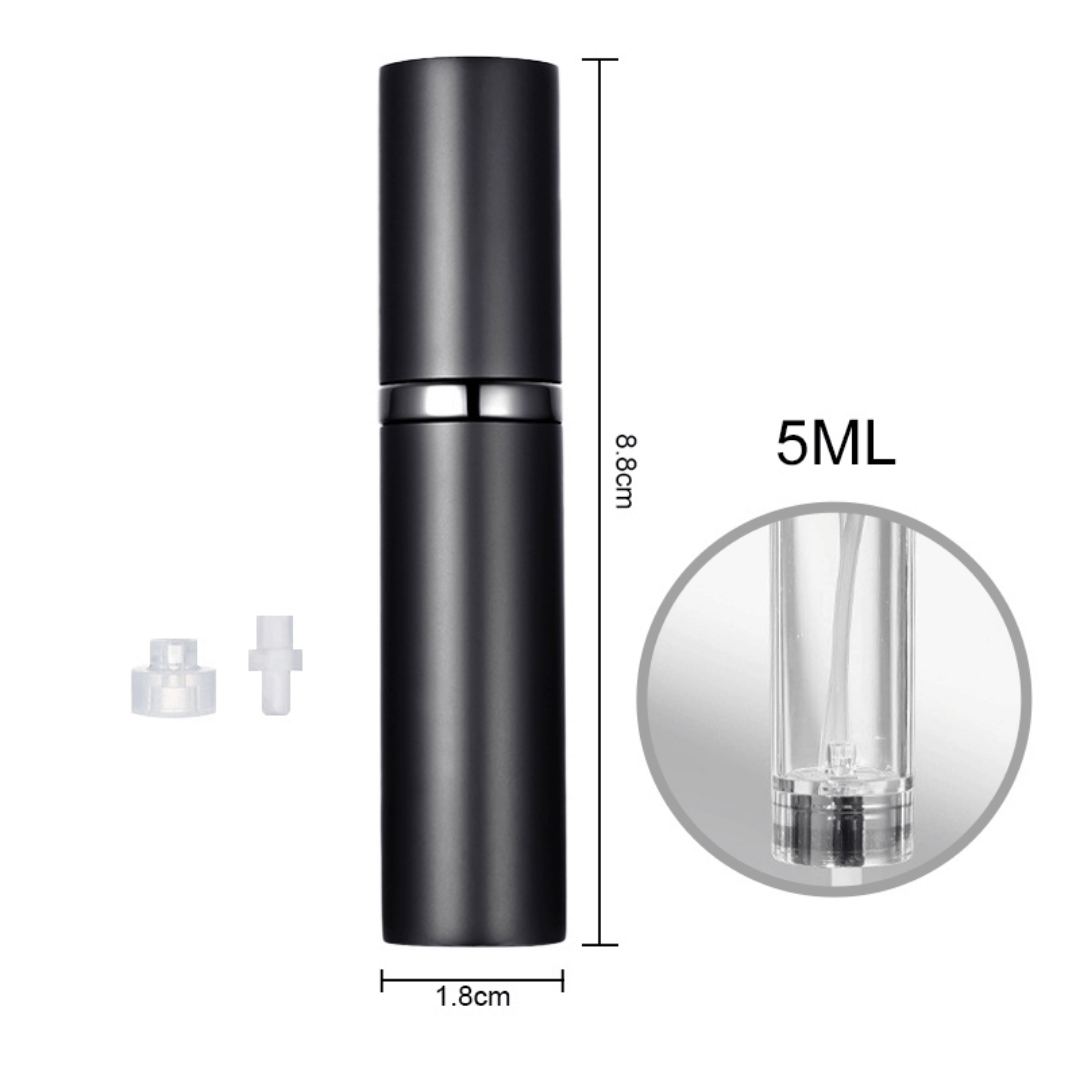 A hand holding a black travel-size perfume atomizer with a fine spray of perfume, highlighting the product's capability to spray without water drops.