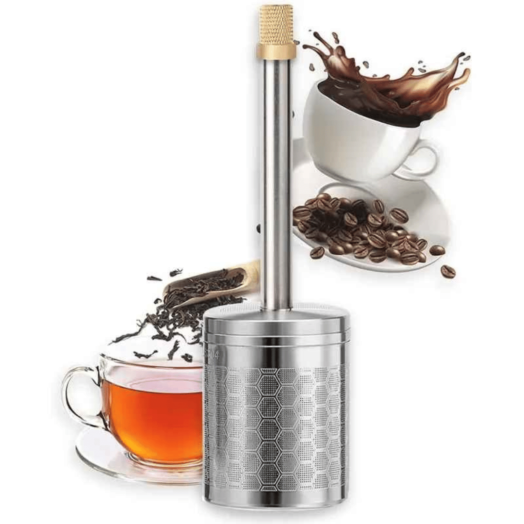 A stainless steel AromaPress lying on a bed of coffee beans, suggesting a connection to coffee brewing.