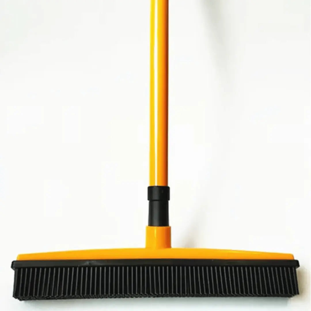 Yellow and black broom on a white background