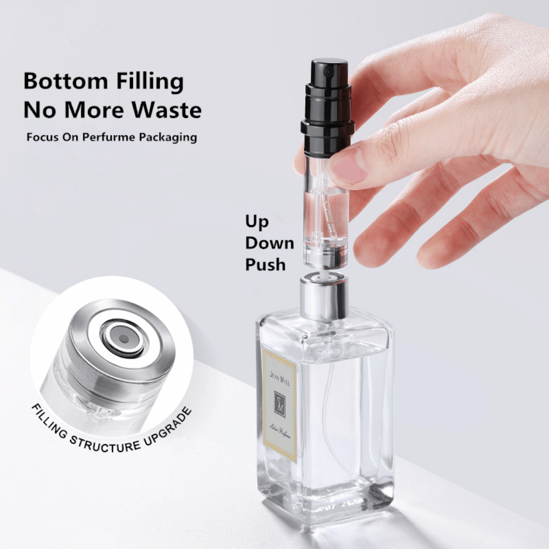 A hand holding a black travel-size perfume atomizer with a fine spray of perfume, highlighting the product's capability to spray without water drops.