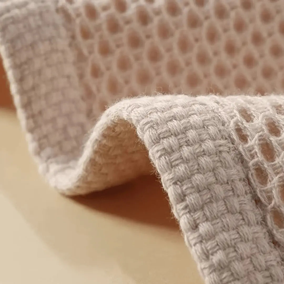 Close-up of textured fabric with a basket in the background