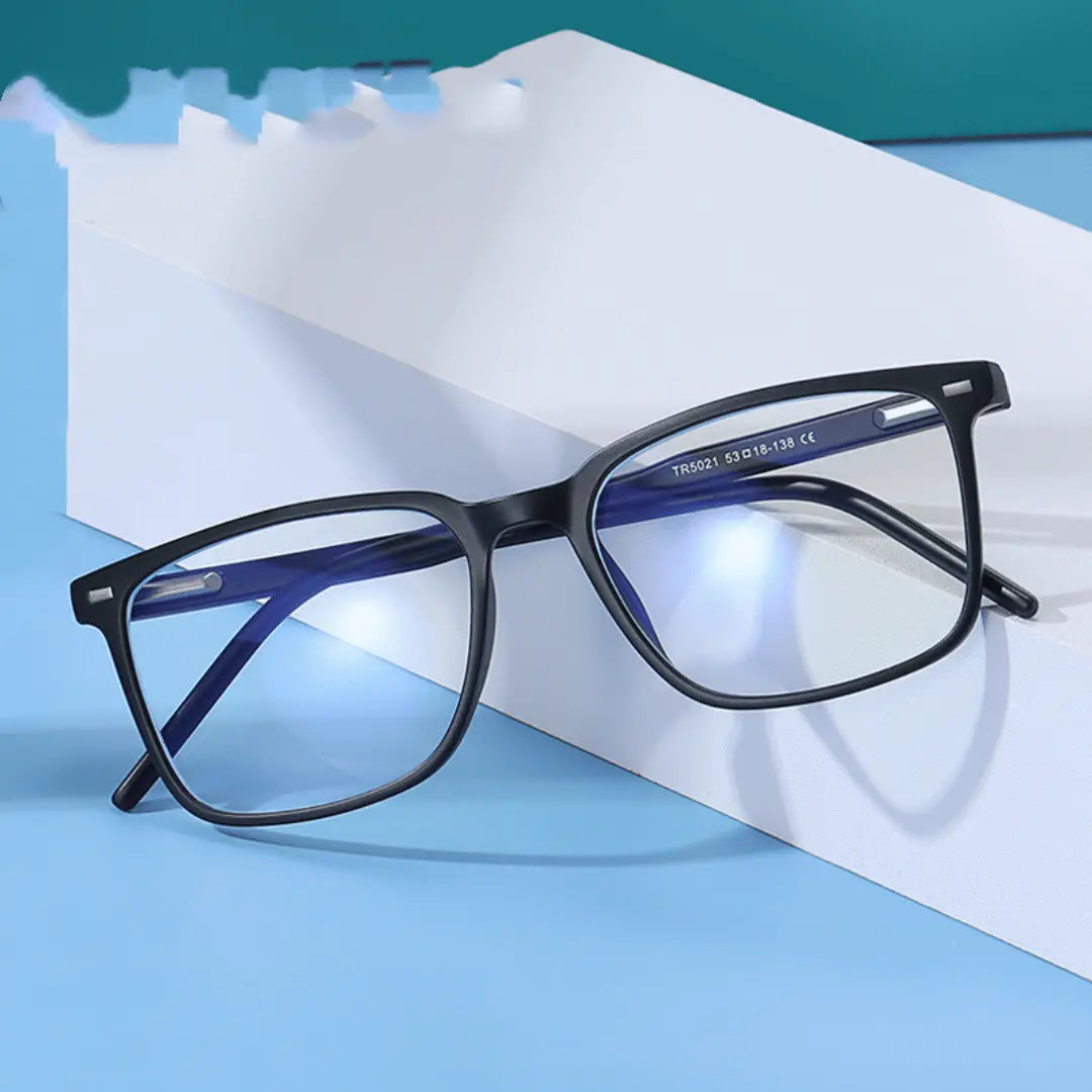 Black eyeglasses with blue-tinted lenses on a white surface with a blue background