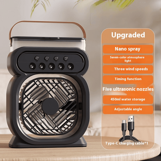 Black portable fan with features listed on an orange panel on a wooden surface.