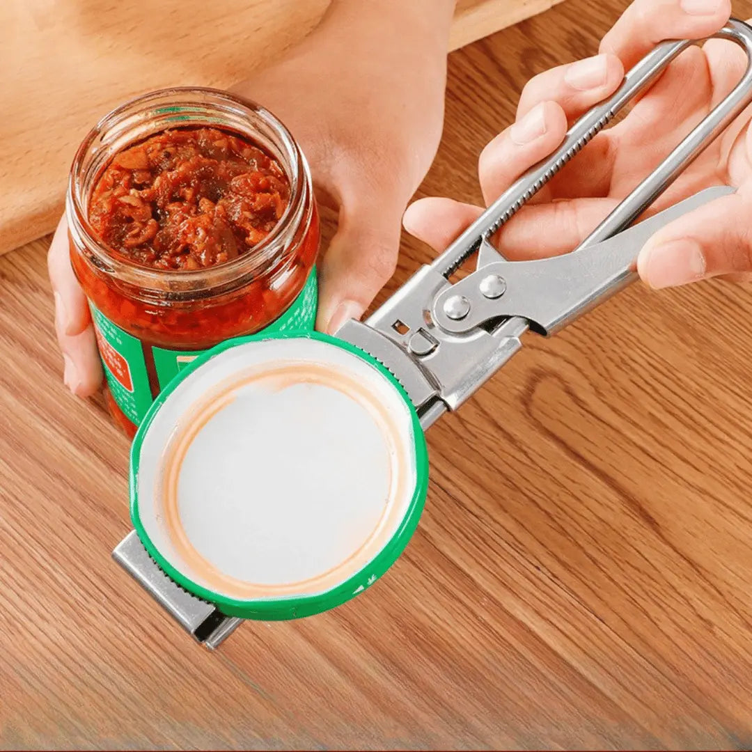 Person using a can opener on a jar of red sauce on a wooden surface