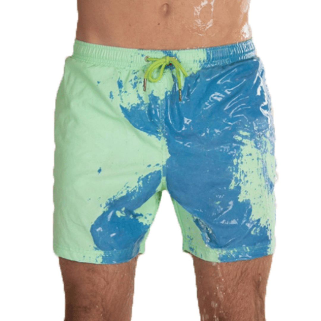 A collection of SplashShift Shorts in various colors, featuring a man modeling the yellow pair, with other pairs shown in blue, orange, and green splattered patterns.