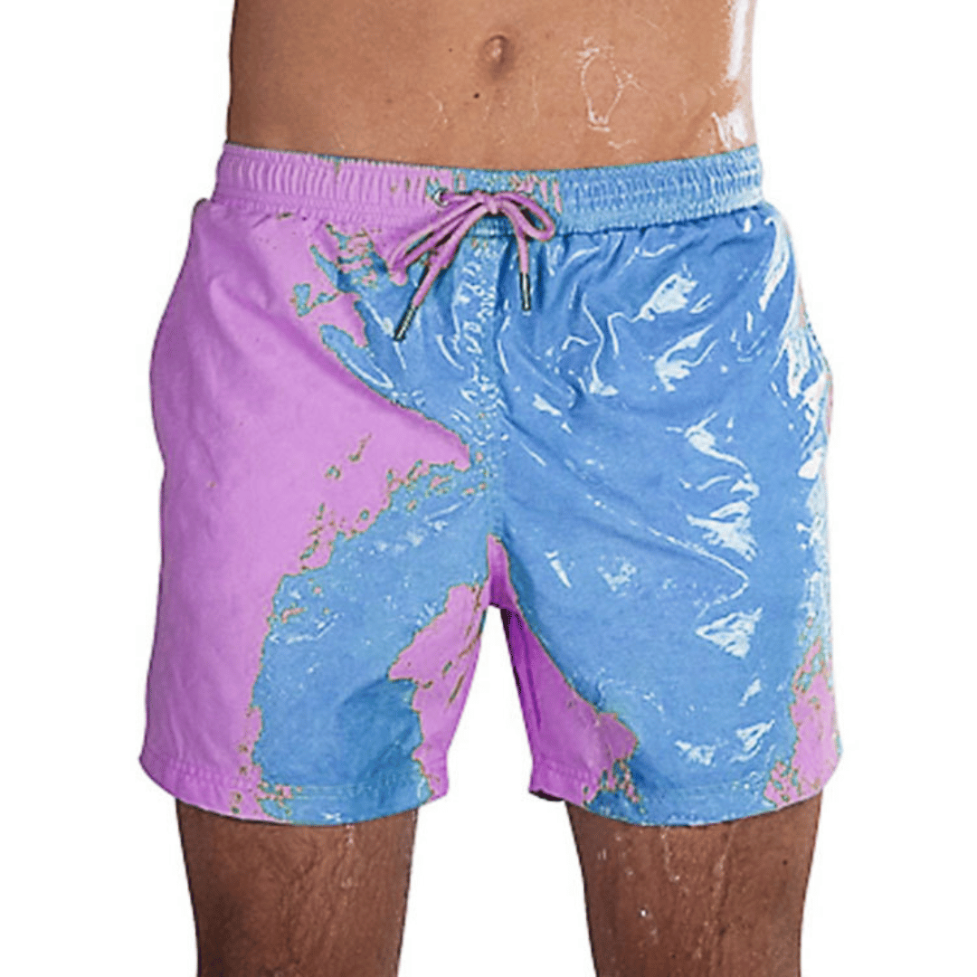 A collection of SplashShift Shorts in various colors, featuring a man modeling the yellow pair, with other pairs shown in blue, orange, and green splattered patterns.