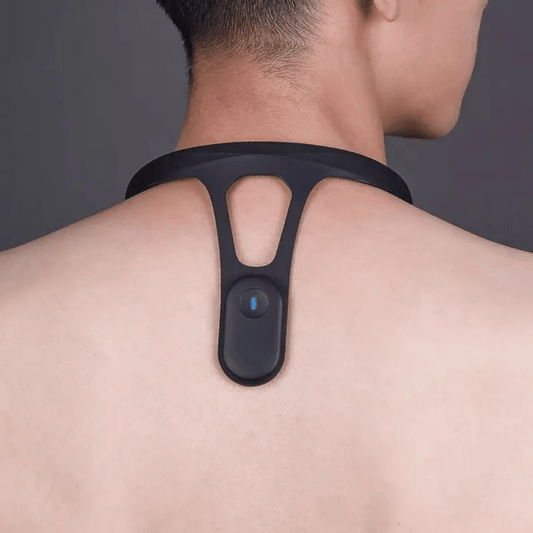 A posture corrector device worn around the neck and back, with a visible blue button, presumably for turning the device on or off.