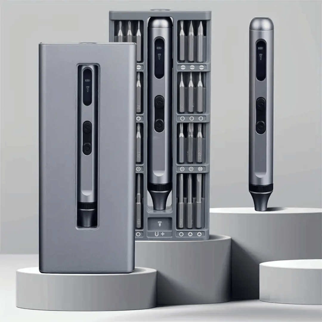 Set of electronic tools with interchangeable bits on a gray background
