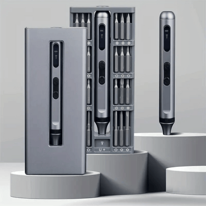 Set of electronic tools with interchangeable bits on a gray background