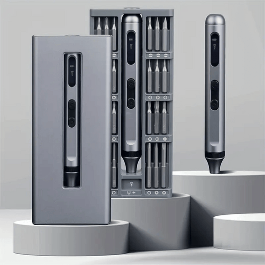 Set of electronic tools with interchangeable bits on a gray background