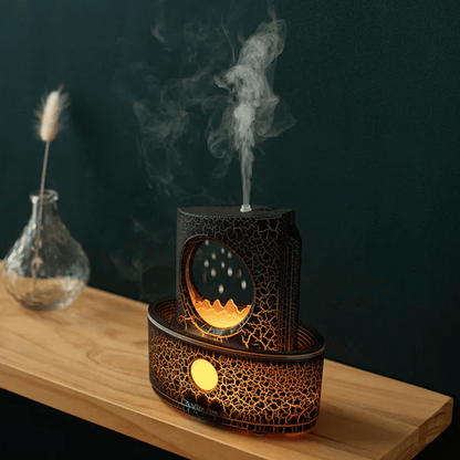 Decorative diffuser with moon and star design on a wooden surface