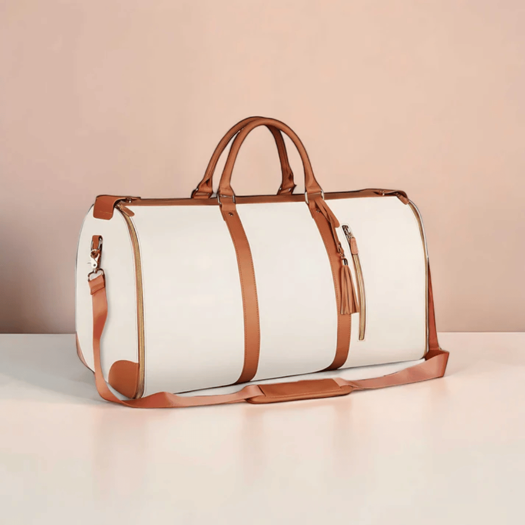 A white and brown Elegance Travel Duffel bag placed against a pink background.