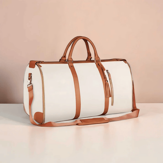A white and brown Elegance Travel Duffel bag placed against a pink background.