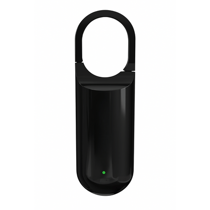 Black electronic device with a green light on a white background