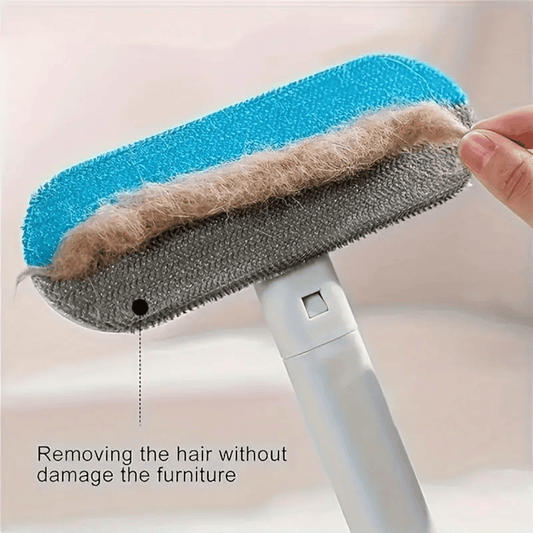 Cleaning tool with a blue, gray, and brown pad being used to remove hair from furniture.