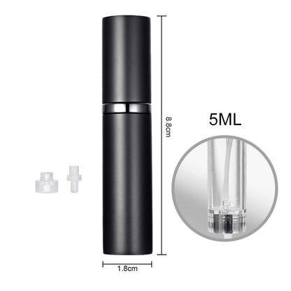 A hand holding a black travel-size perfume atomizer with a fine spray of perfume, highlighting the product's capability to spray without water drops.