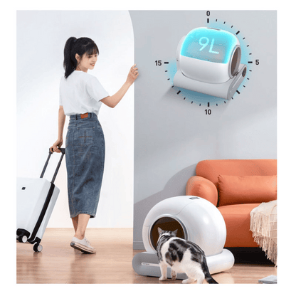 IntelliPurr litter box internal mechanism showing automatic cleaning system and waste collection tray
