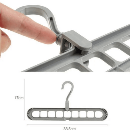 A set of multi-functional space-saving hangers arranged in a wardrobe, holding various garments.