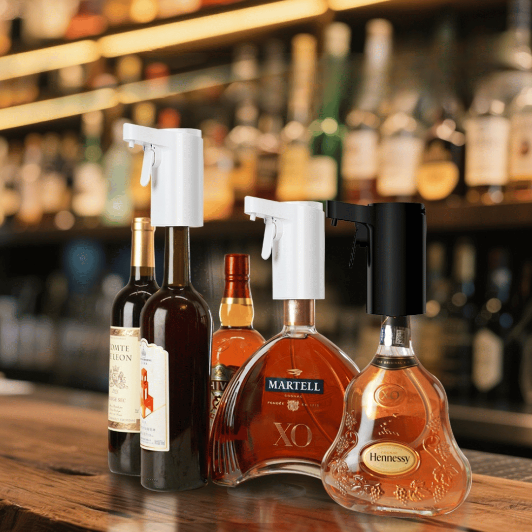 Bottles of Hennessy and Martell with spray nozzles on a bar counter.