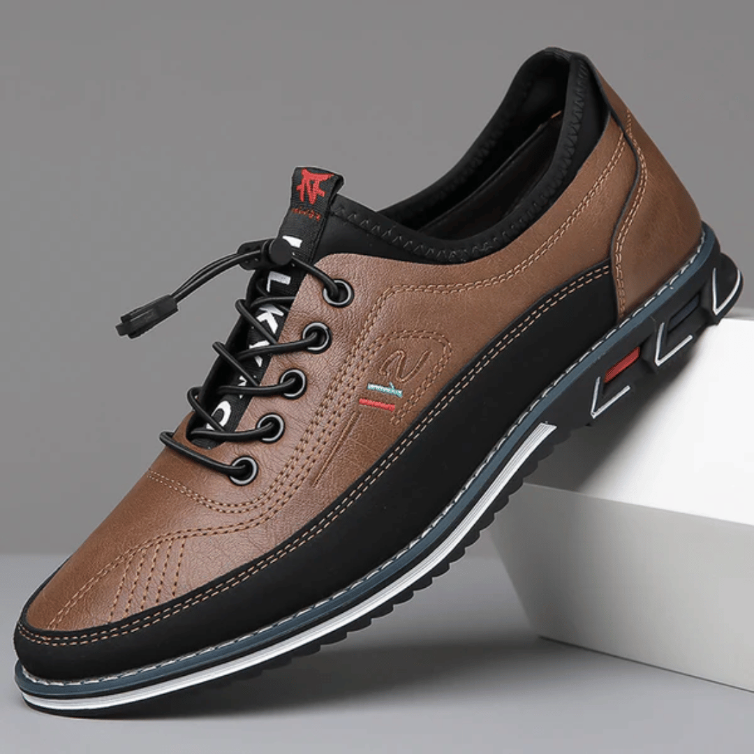 A pair of Oxford Comfort Sneakers featuring a brown upper with black accents and a white sole.