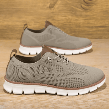 A pair of black Hugo Ultra Comforatable Shoes with a lace-up closure, featuring a breathable knit upper, a removable honeycomb foam footbed, and a high-density TPU sole.