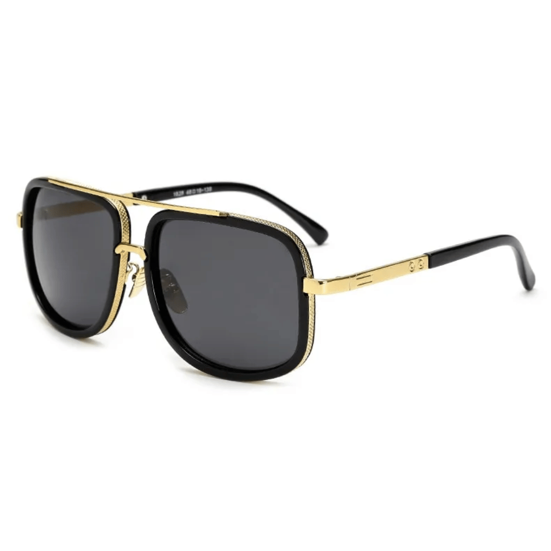 A pair of aviator-style sunglasses with black plastic frames and gold metal accents. The lenses appear to be dark tinted.