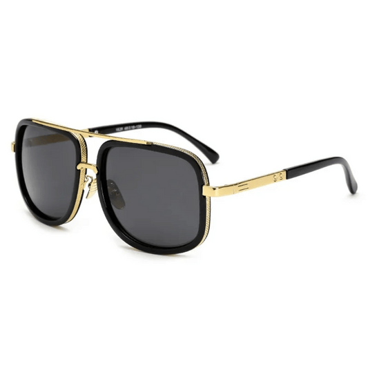 A pair of aviator-style sunglasses with black plastic frames and gold metal accents. The lenses appear to be dark tinted.