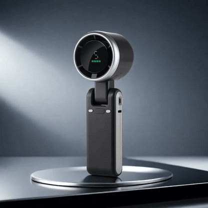 Black and silver device on a stand with a dark background