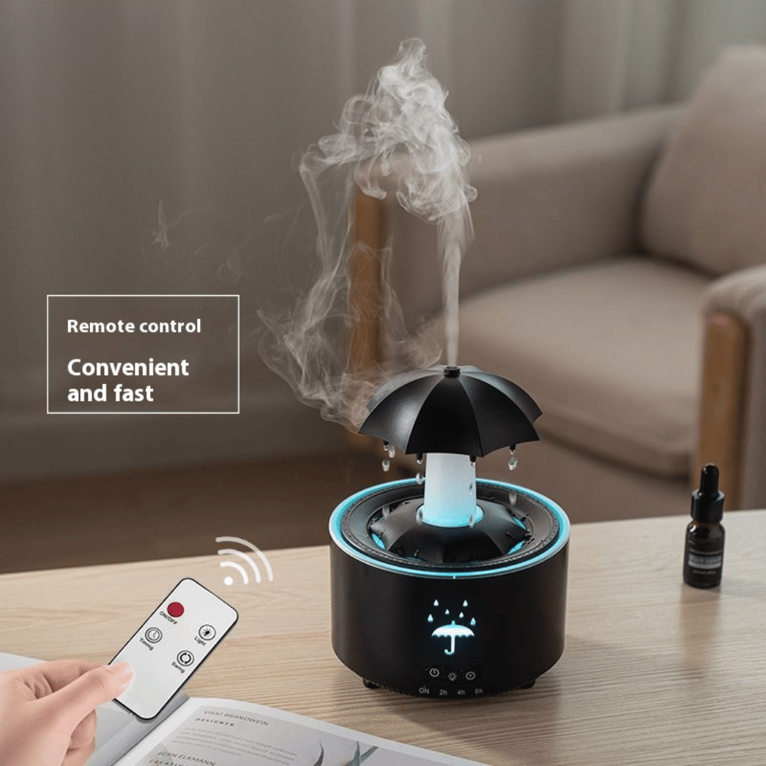 Black umbrella-shaped humidifier with remote control on a table