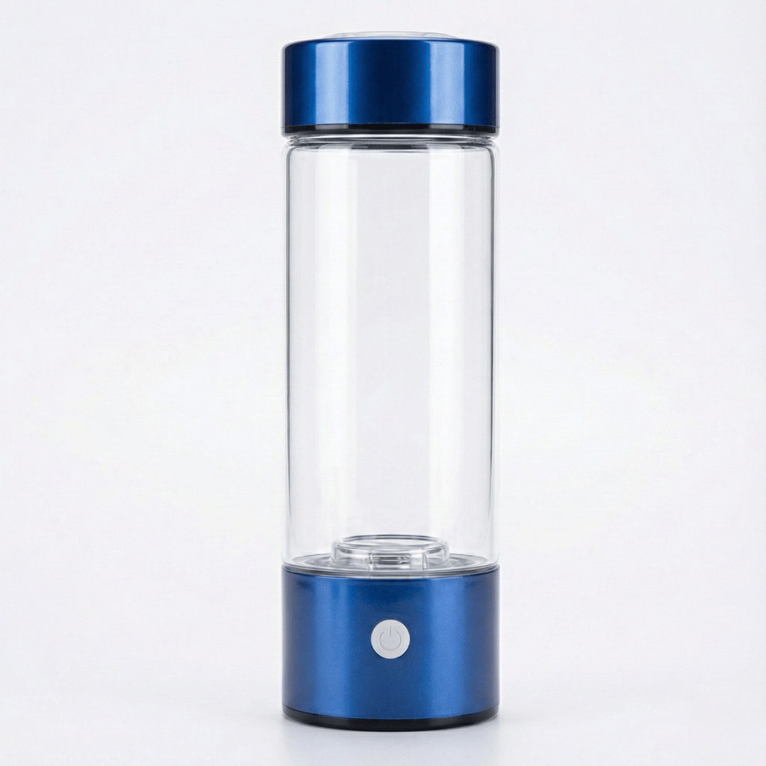 Clear glass bottle with blue metal cap and base on a white background