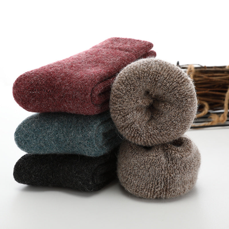 Stack of colorful socks on a white background