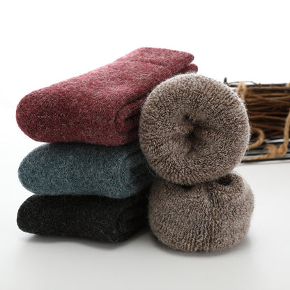 Stack of colorful socks on a white background