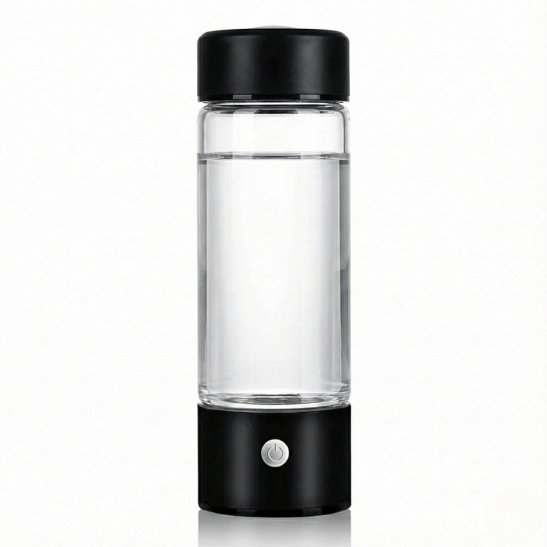 Clear glass bottle with black lid and base on a white background