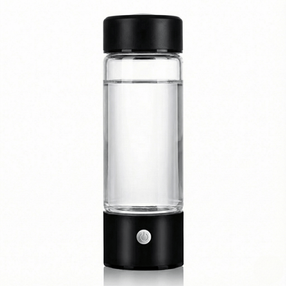 Clear glass bottle with black lid and base on a white background