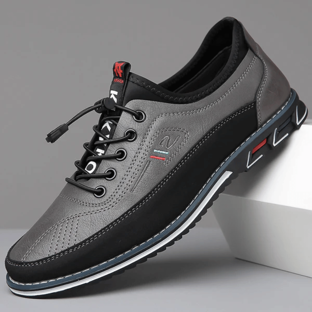 A pair of Oxford Comfort Sneakers featuring a brown upper with black accents and a white sole.