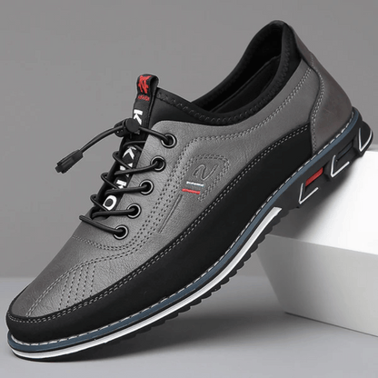 A pair of Oxford Comfort Sneakers featuring a brown upper with black accents and a white sole.