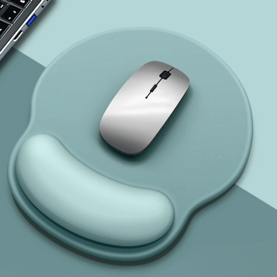 Silver computer mouse on a wrist rest with a light blue background