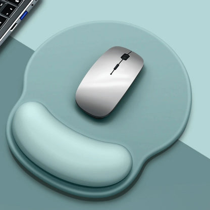 Silver computer mouse on a wrist rest with a light blue background