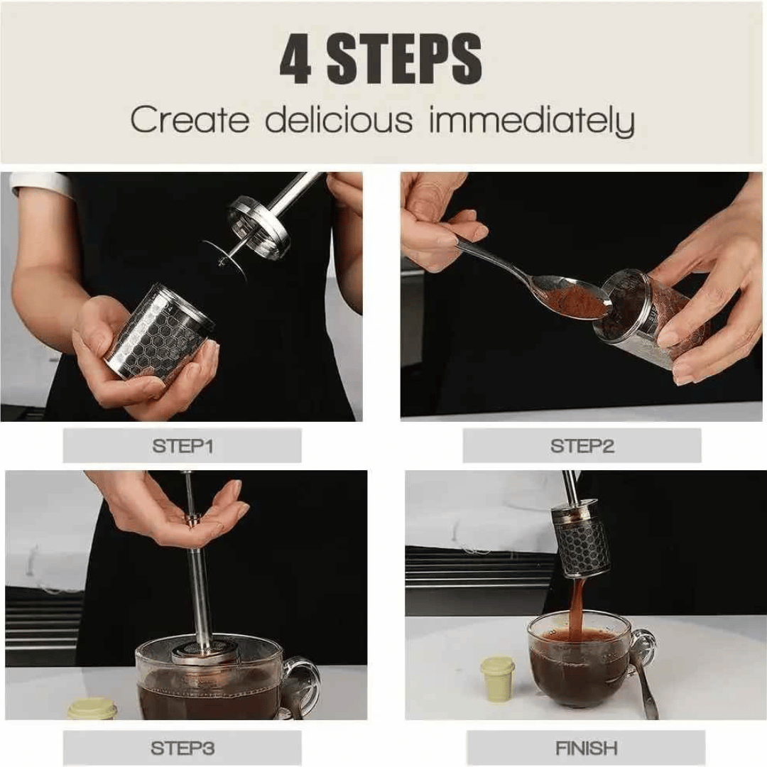 A stainless steel AromaPress lying on a bed of coffee beans, suggesting a connection to coffee brewing.
