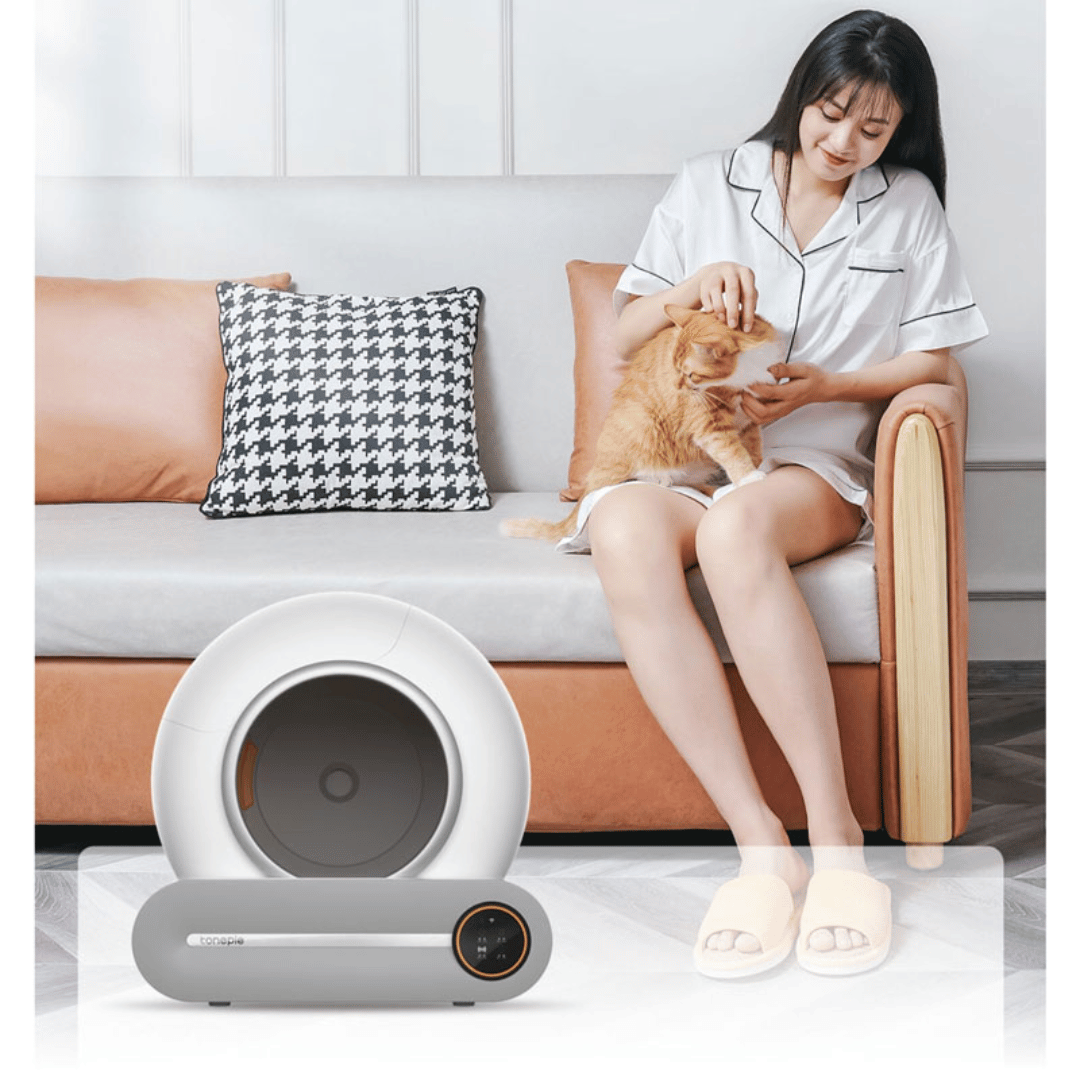 IntelliPurr litter box internal mechanism showing automatic cleaning system and waste collection tray