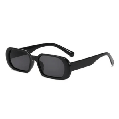 A pair of NoirVision black sunglasses with a minimalist design, displayed against a white background.