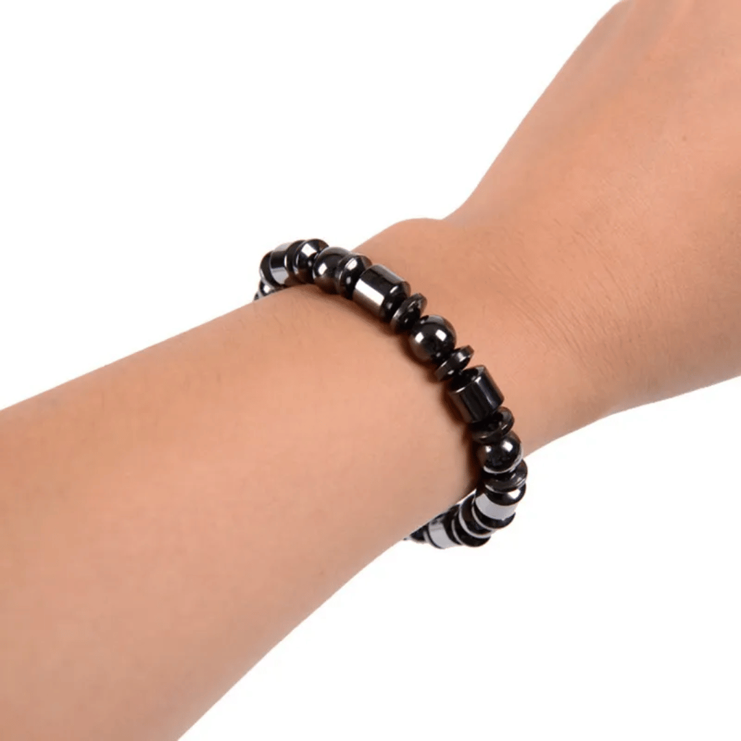 Close-up view of MetaBand hematite stone magnetic bracelet showing premium black stones and sleek design