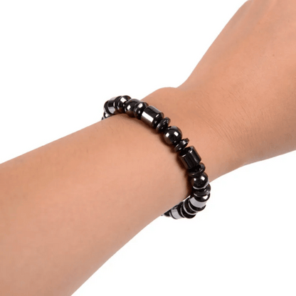 Close-up view of MetaBand hematite stone magnetic bracelet showing premium black stones and sleek design