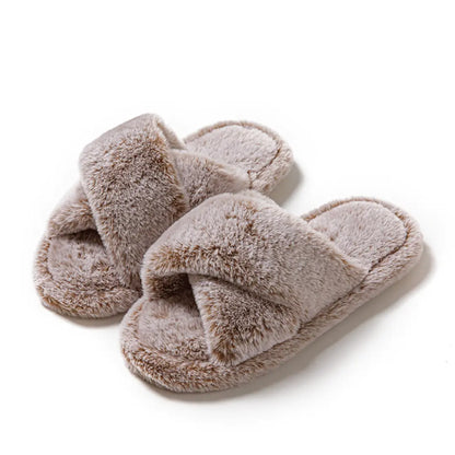 Pair of fluffy slippers on a white background