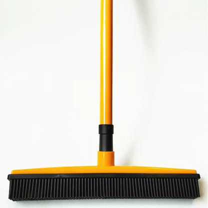 Yellow and black broom on a white background