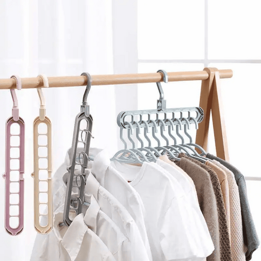 A set of multi-functional space-saving hangers arranged in a wardrobe, holding various garments.