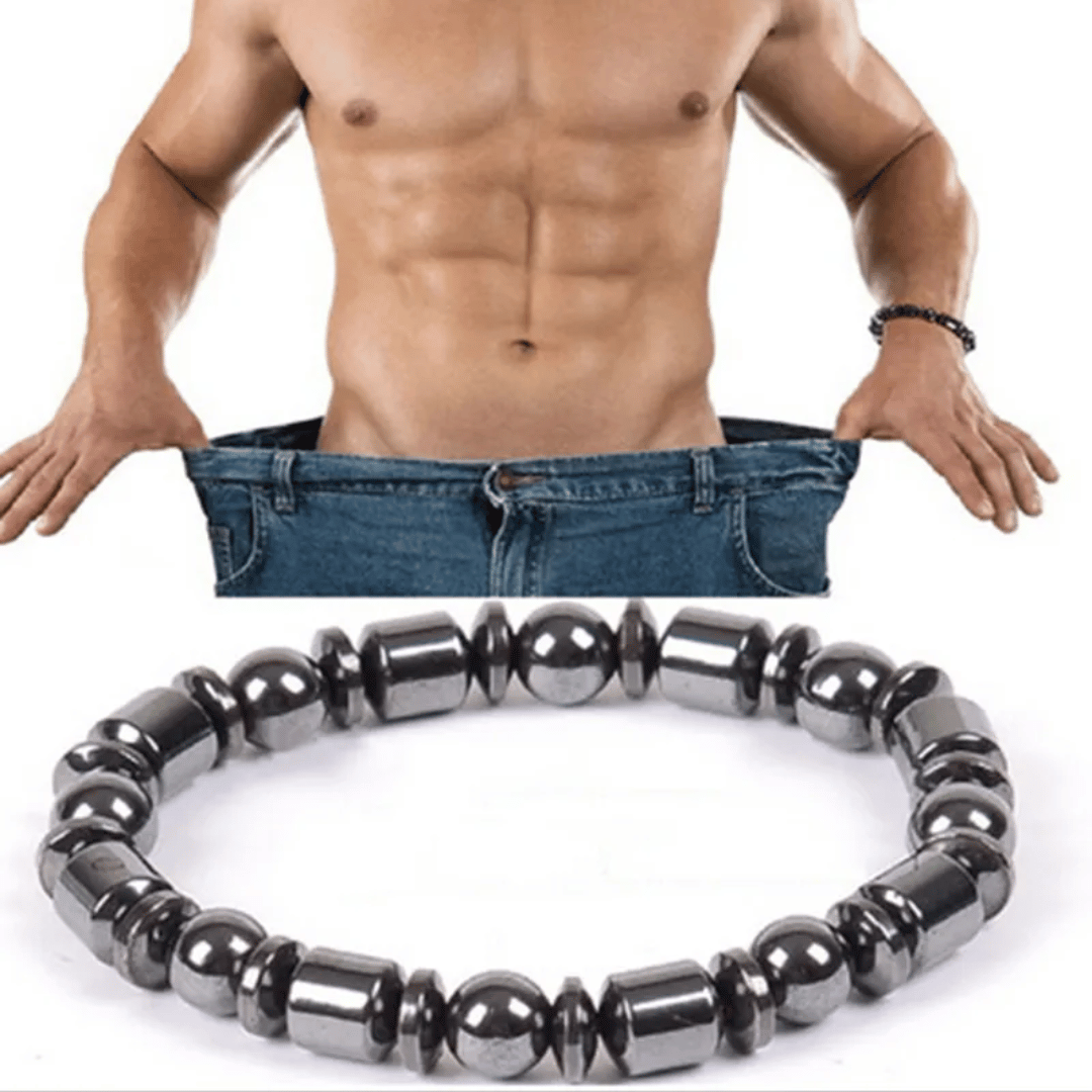 A metabolism booster bracelet, featuring black hematite stones, is displayed in front of a shirtless man wearing blue jeans, highlighting the bracelet's sleek and unisex design.