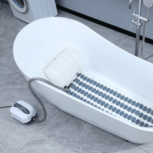 A Hydro Massage Bath Mat with bubble massage technology, placed in a bathtub, with a control unit on the floor beside it.