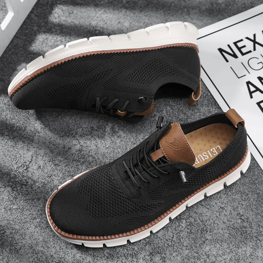 A pair of black Hugo Ultra Comforatable Shoes with a lace-up closure, featuring a breathable knit upper, a removable honeycomb foam footbed, and a high-density TPU sole.