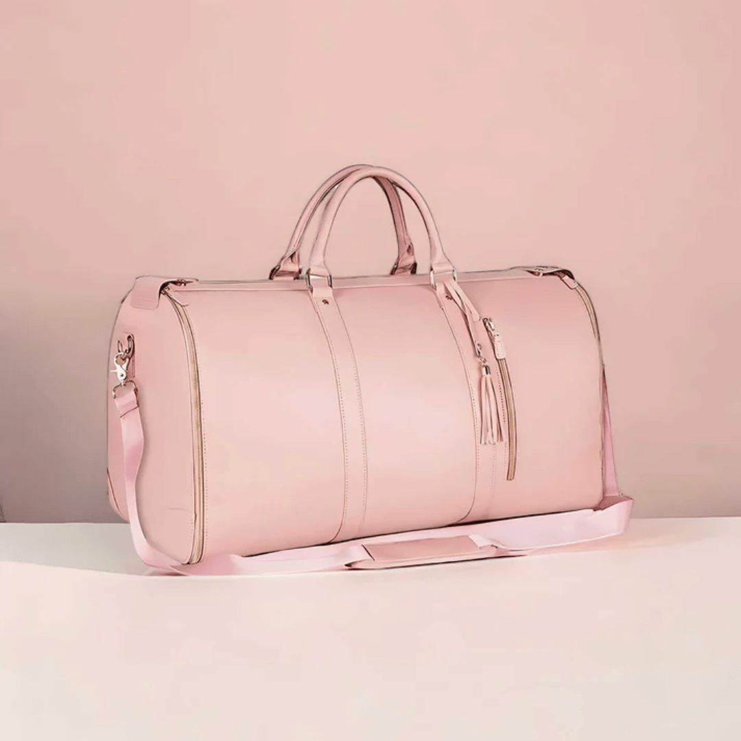 A white and brown Elegance Travel Duffel bag placed against a pink background.